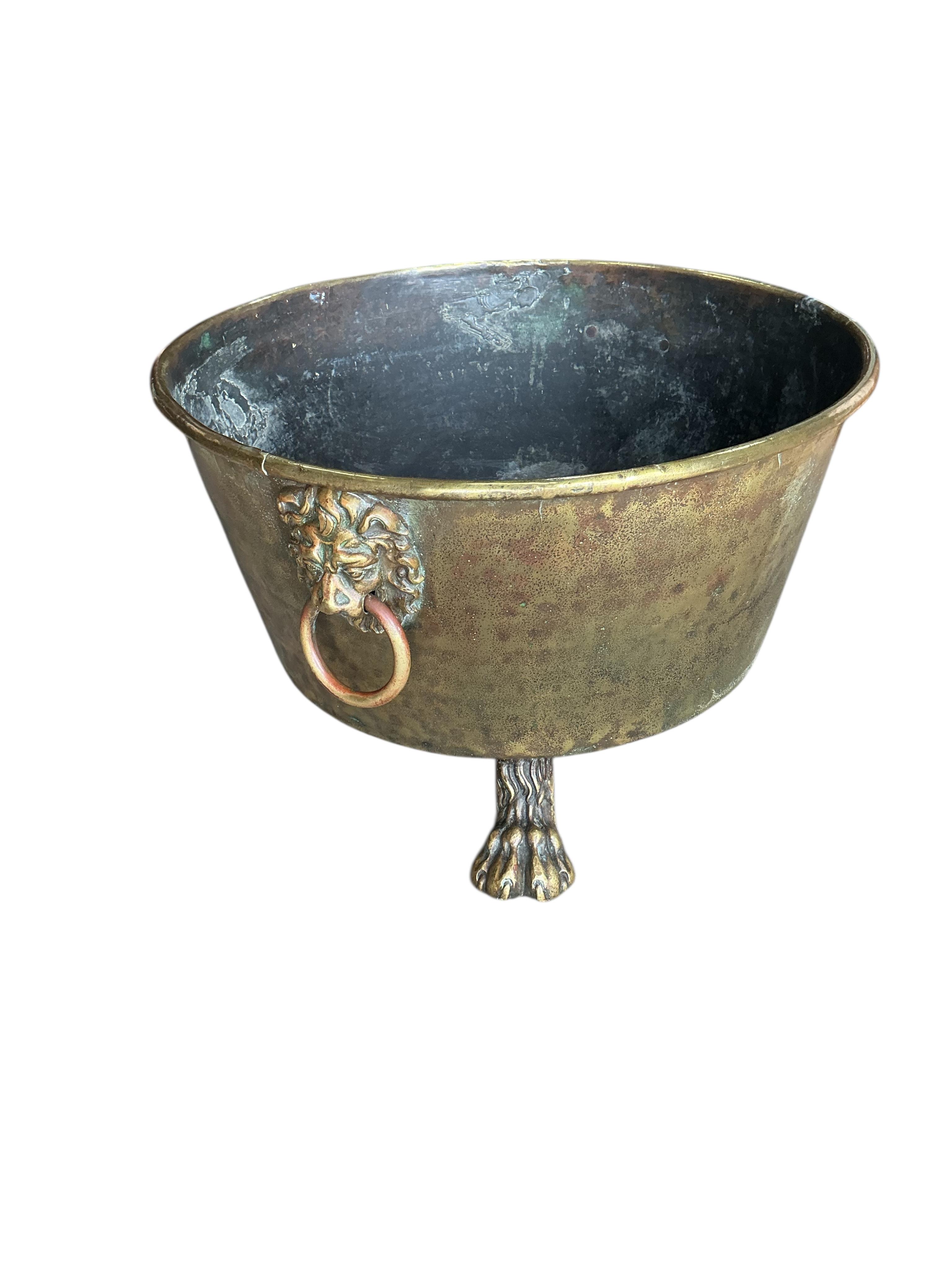 A circular brass log bin, diameter 56cm, height 34cm